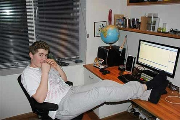 Me in 2011, with Visual Studio open in the background.