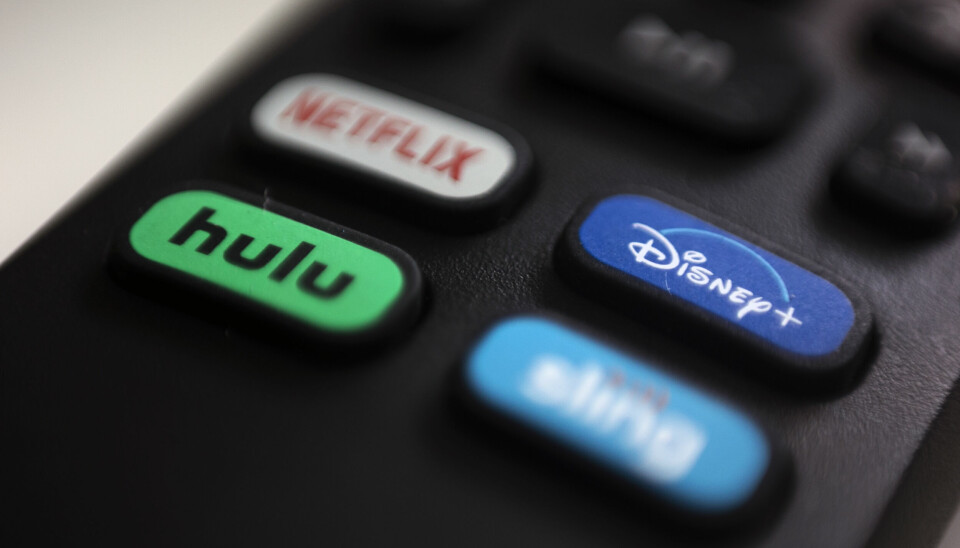 FILE - In this Aug. 13, 2020 file photo, the logos for Netflix, Hulu, Disney Plus and Sling TV are pictured on a remote control in Portland, Ore. As streaming services proliferate, it can be a challenge to keep track of where some favorite TV shows and blockbuster movies are available. (AP Photo/Jenny Kane)